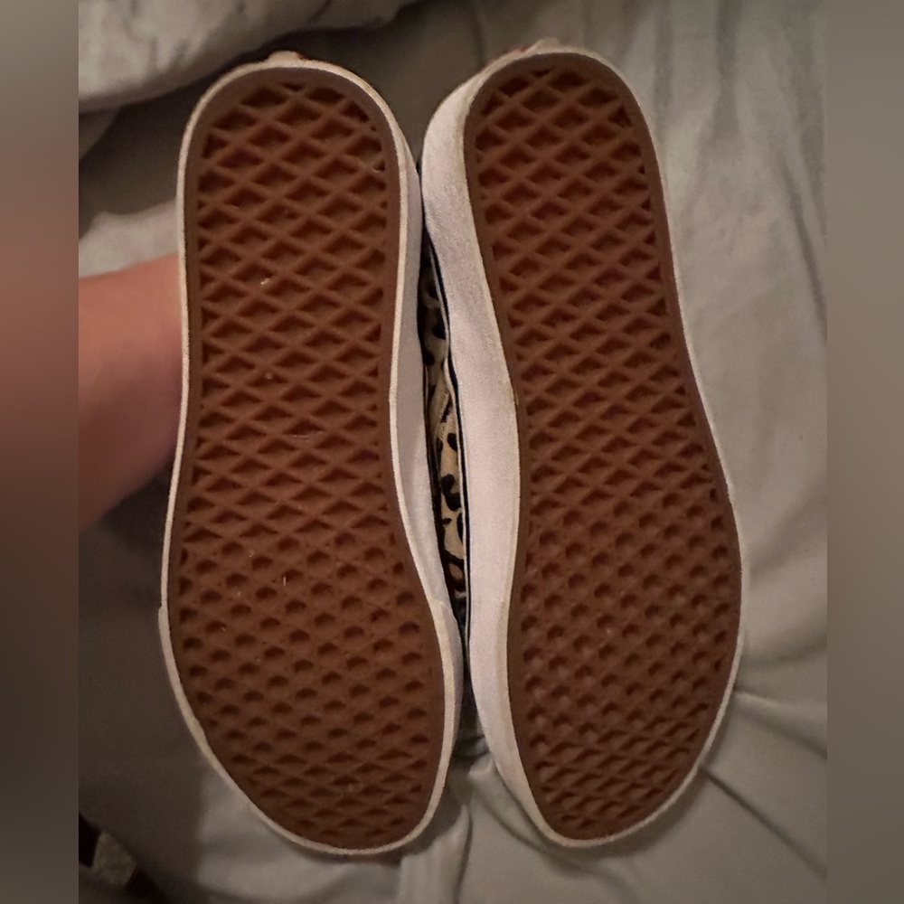Vans cheetah slip on sneakers.